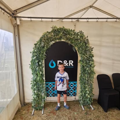 D&R Plumbing & Gas Services branded banner and marquee at a Kalgoorlie community event